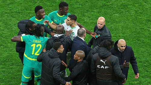 | Photo: AP/Youssef Loulidi : Moroccos Achraf Hakimi, center, clashes with Senegal players after a controversial penalty was awarded to Morocco late on during the Africa Cup of Nations final soccer match between Senegal and Morocco in Rabat, Morocco, Sunday, Jan. 18, 2026.