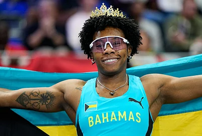 | Photo: AP/Matthias Schrader : Devynne Charlton, of Bahamas, poses after winning the gold medal in the womens 60 meters hurdles final at the World Athletics Indoor Championships in Torun, Poland.