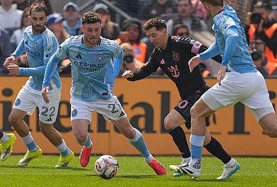 | Photo: AP/Seth Wenig : Inter Miamis Lionel Messi, second from right, moves the ball through New York City FC defenders during the first half of an MLS soccer game at Yankee Stadium in New York.