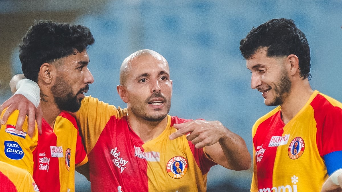 IndSuperLeague/X : East Bengal footballers celebrating a goal against Mohammedan SC in ISL 2025-26. 
