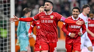 | Photo: dpa/Harry Langer via AP : Stuttgart's Deniz Undav, front, celebrates after scoring his side's fourth goal during the German Bundesliga soccer match between FC Augsburg and VfB Stuttgart in Augsburg, Germany, Sunday, March 22, 2026.