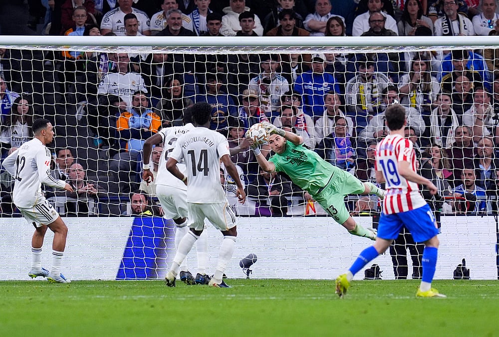 | Photo: AP/Manu Fernandez : Real Madrids goalkeeper Andriy Lunin, centre, makes a save during the Spanish La Liga soccer match between Real Madrid and Atletico Madrid in Madrid, Spain.