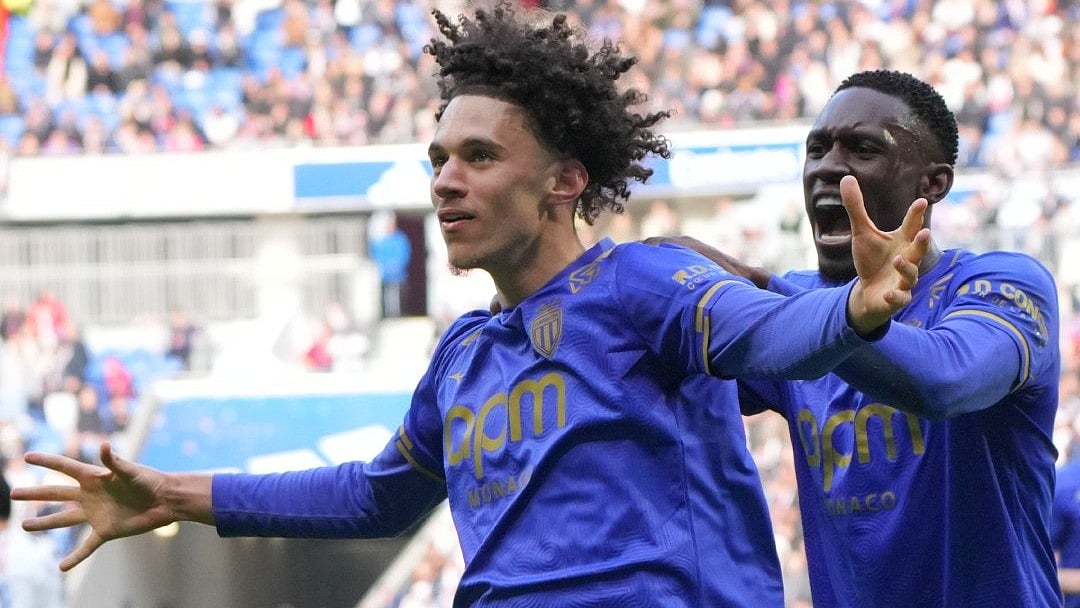 | Photo: X/AS_Monaco_EN : Monaco's Maghnes Akliouche celebrates with teammate FOlarin Balogun after scoring during the Ligue 1 match against Lyon on March 22, 2026.