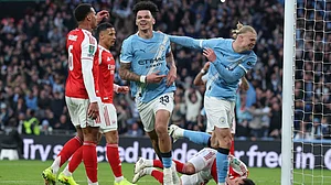 AP Photo : Manchester City's Nico O'Reilly celebrates after scoring the opening goal during the English League Cup final soccer match between Arsenal and Manchester City in London, Sunday, March 22, 2026.