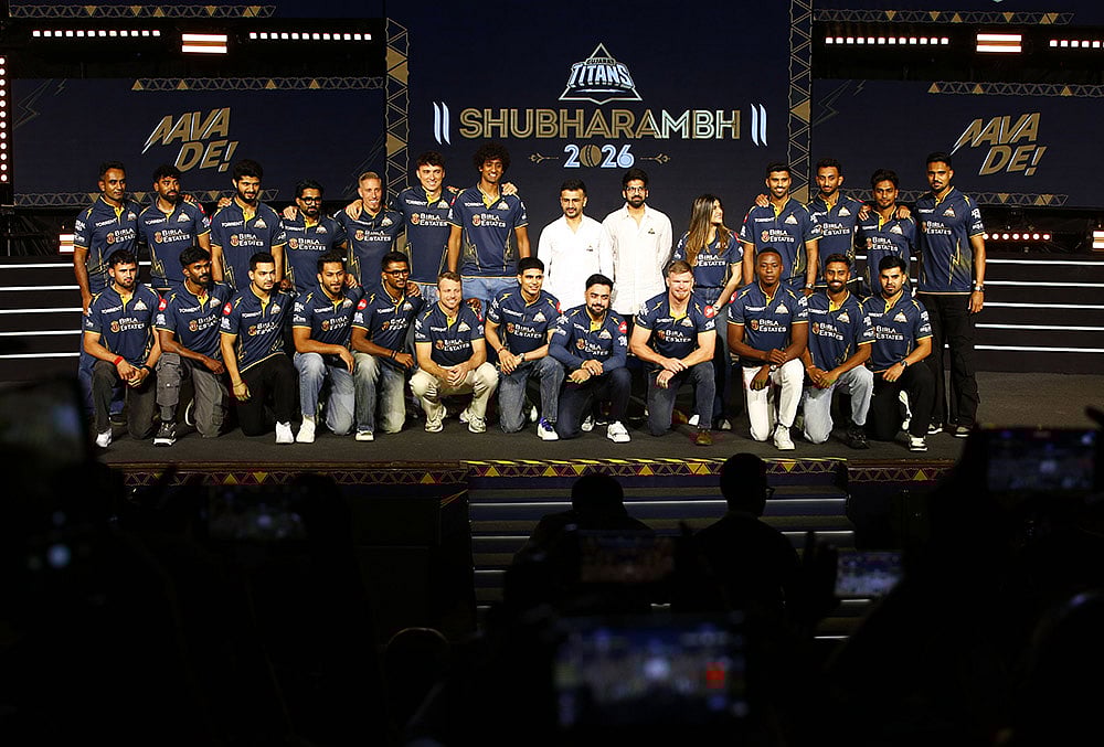 | Photo: PTI  : Gujarat Titans skipper Shubman Gill with team players, GTs directors Shaan Mehta and Jinal Mehta, former England player and GT’s director of cricket Vikram Solanki and others pose for a group photograph during the franchises Shubharambh 2026 event featuring the squad, owners and partners, in Ahmedabad.