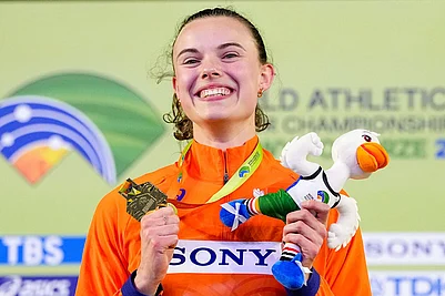 | Photo: AP/Petr David Josek : Sofie Dokter, of the Netherlands, poses on the podium after winning a gold medal in the womens pentathlon at the World Athletics Indoor Championships in Torun, Poland.