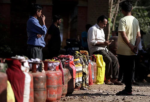 | Photo: PTI : People wait in a queue with empty LPG cooking gas cylinders to avail refilled ones amid the ongoing supply crisis, in Prayagraj.