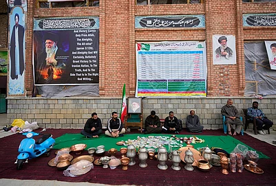 | Photo: AP/Mukhtar Khan : Volunteers wait at a collection point during a donation drive for Iran in Budgam, Kashmir.