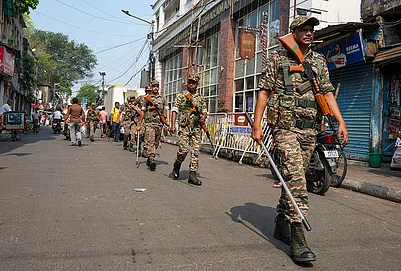 | Photo: PTI/Swapan Mahapatra : Security personnel keep vigil during a religious procession to mark the Ram Navami festival, in Kolkata, West Bengal.