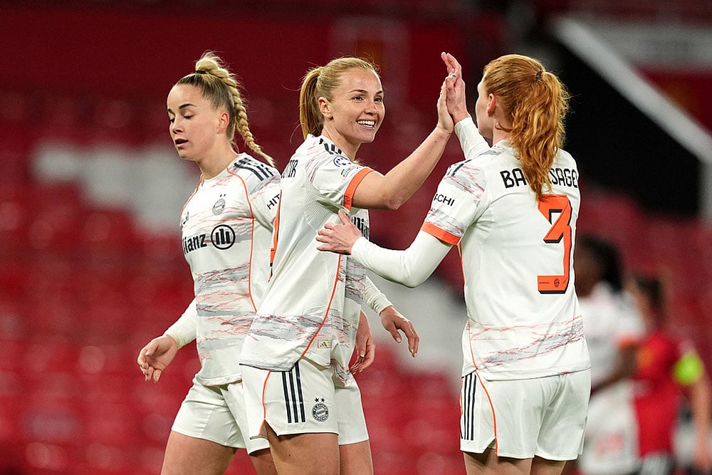 | Photo: Martin Rickett/PA via AP : Bayern Munich's Glodis Viggosdottir, center, and teammates celebrate following victory during the Women's Champions League match between Manchester United and Bayern Munich, in Manchester, England.