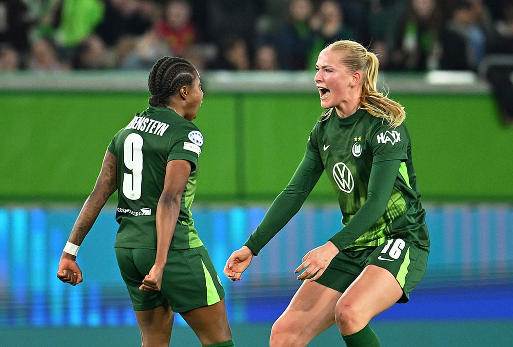 | Photo: Swen Pfortner/dpa via AP : Wolfburg's Lineth Beerensteyn, left, celebrates after scoring with teammate Camilla Kuever during their Champions League quarter-finals, first leg soccer match in Wolfsburg, Germany.