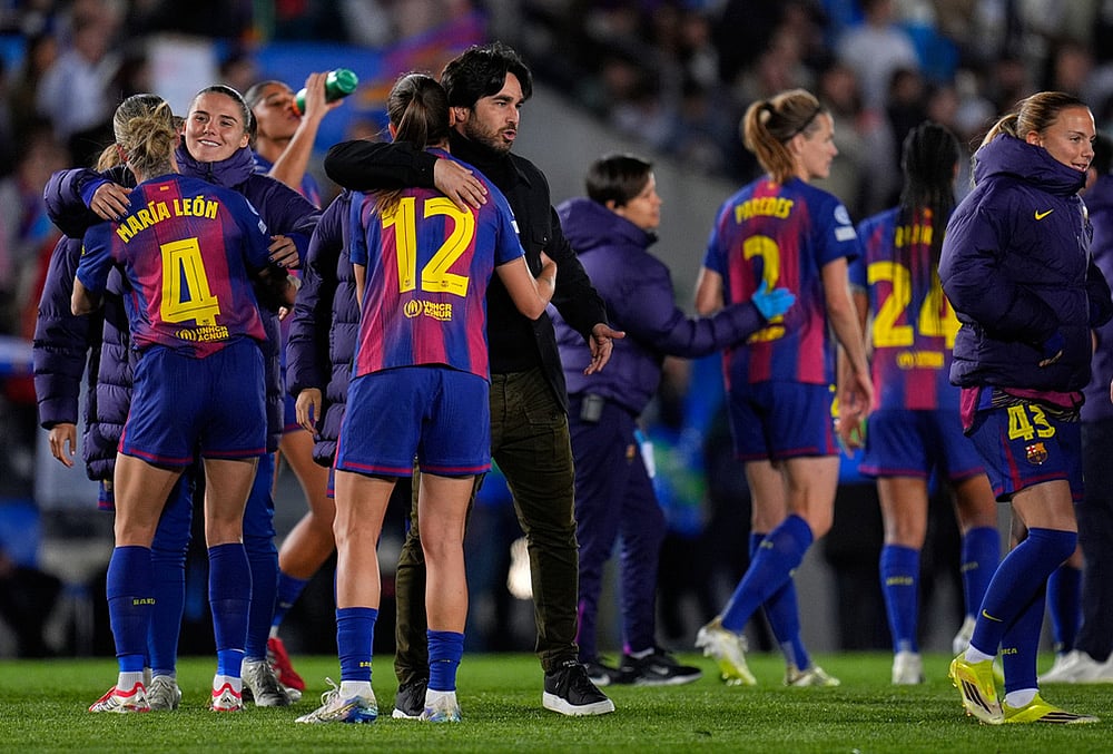 | Photo: AP/Manu Fernandez : Barcelona's coach Pere Romeu greets his players after the women's Champions League quarterfinal first leg soccer match between Real Madrid and Barcelona in Madrid, Spain.