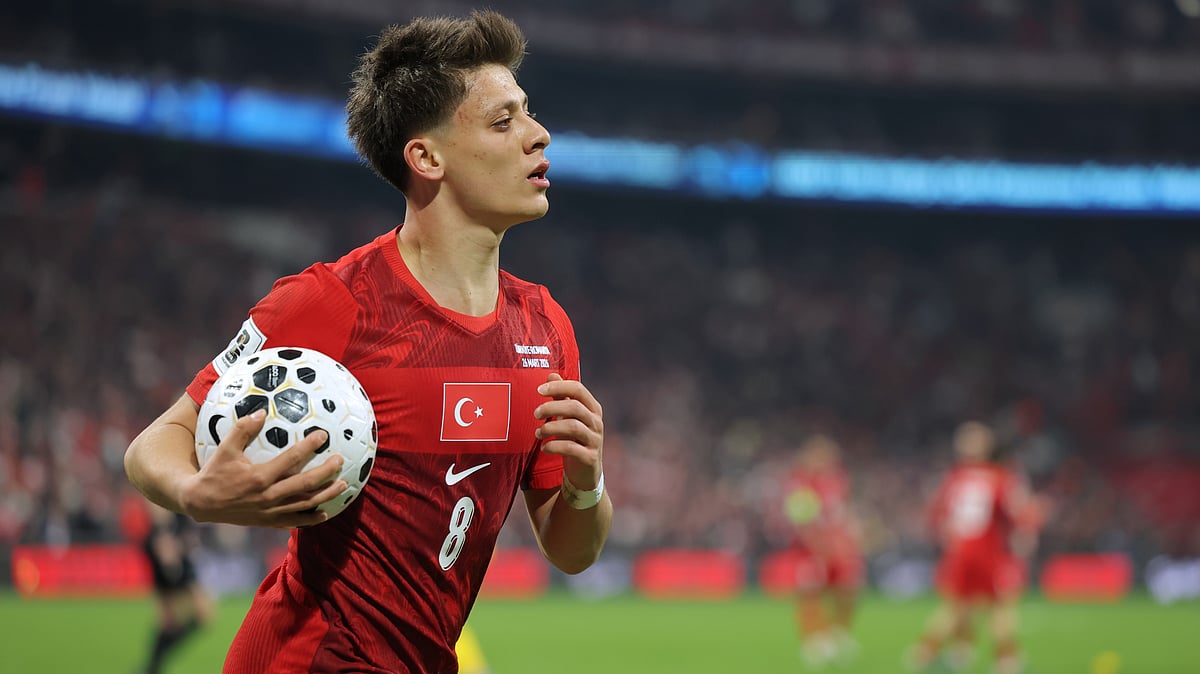 (AP Photo) : Turkey's Arda Guler grabs the ball during the 2026 World Cup playoff semifinal soccer match between Turkey and Romania, in Istanbul, Turkey, Thursday, March 26, 2026