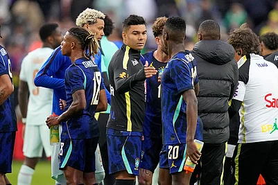| Photo: AP/Charles Krupa : Brazils Casemiro, center, greets teammate Luiz Henrique as he leaves the field after the international friendly soccer match between Brazil and France in Foxborough, Mass.