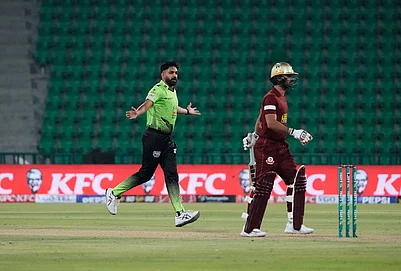 | Photo: AP/K.M. Chaudary : Lahore Qalandars Haris Rauf, left, celebrates after taking the wicket of Hyderabad Kingsmen Hassan Khan, right, during the opening cricket match of the Pakistan Super League between Lahore Qalandars and Hyderabad Kingsmen, which taking place without spectators, in Lahore, Pakistan.