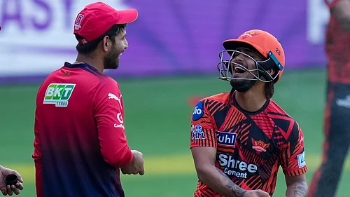PTI/Shailendra Bhojak : SunRisers Hyderabads captain Ishan Kishan, right, with Royal Challengers Bengalurus Jitesh Sharma during a practice session on the eve of their Indian Premier League 2026 match at M Chinnaswamy Stadium in Bengaluru.