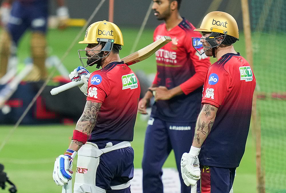 | Photo: PTI/Shailendra Bhojak : Royal Challengers Bengaluru’s Virat Kohli, left, and Phil Salt, right, during a practice session ahead of the Indian Premier League (IPL) 2026 cricket match against Sunrisers Hyderabad, at M. Chinnaswamy Stadium in Bengaluru.