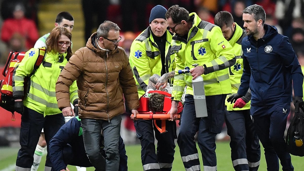 AP : Republic of Ireland's Sammie Szmodics receives medical attention after sustaining an injury during the World Cup playoff game against Czechia.