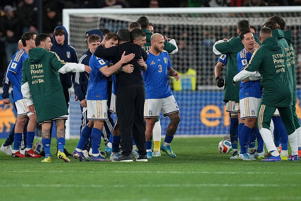 | Photo: AP/Antonio Calanni : Italian and Northern Ireland players react after the World Cup qualifying play-off soccer match between Italy and Northern Ireland, in Bergamo, Italy.