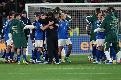 | Photo: AP/Antonio Calanni : Italian and Northern Ireland players react after the World Cup qualifying play-off soccer match between Italy and Northern Ireland, in Bergamo, Italy.