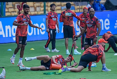 | Photo: PTI/Shailendra Bhojak : Sunrisers Hyderabad’s Pat Cummins with teammates during a practice session on the eve of the Indian Premier League (IPL) 2026 cricket match against Royal Challengers Bengaluru, at M Chinnaswamy Stadium in Bengaluru, Karnataka.