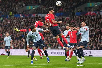 | Photo: AP/Alastair Grant : Englands Dominic Solanke heads the ball during the international friendly soccer match between England and Uruguay in London.