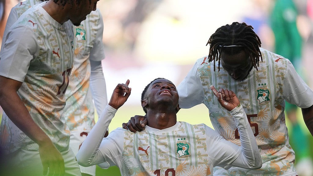 Photo: AP : Ivory Coast's Simon Adingra, centre, celebrates scoring his side's second goal during the international friendly match against South Korea in Milton Keynes, England.