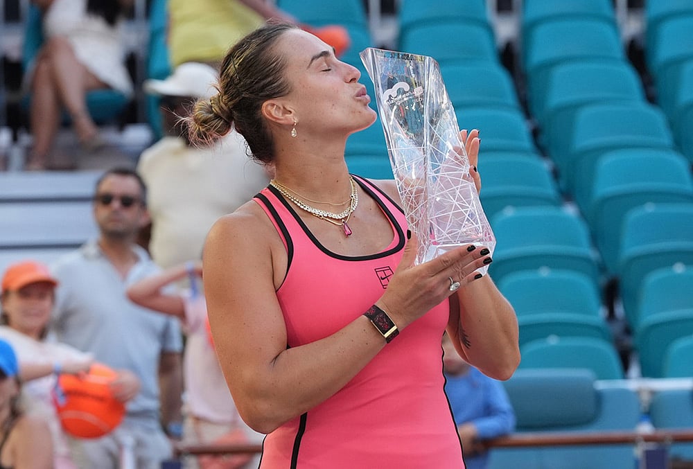 | Photo: AP/Marta Lavandier : Aryna Sabalenka kisses the trophy after winning the womens singles final at the Miami Open tennis tournament in Miami Gardens, Florida. 