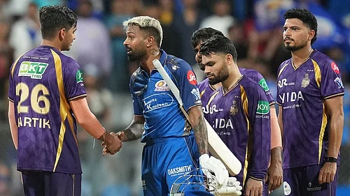 | Photo: AP/Rafiq Maqbool : Mumbai Indians captain Hardik Pandya, second left, shake hands with Kolkata Knight Riders Kartik Tyagi after won the match during the Indian Premier League cricket match between Mumbai Indians and Kolkata Knight Riders in Mumbai.