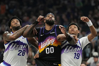 | Photo: AP/Ross D. Franklin : Utah Jazz forward Brice Sensabaugh (28), Phoenix Suns forward Royce ONeale (00) and Jazz guard Ace Bailey (19) battle for position for a rebound during the first half of an NBA basketball game in Phoenix.