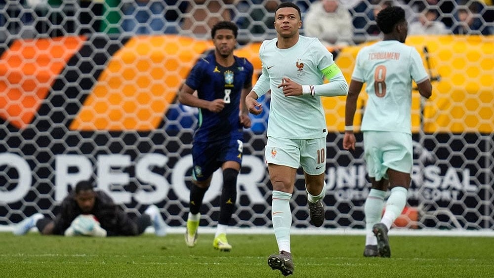 | Photo: AP/Charles Krupa : Kylian Mbappe of France runs during the international friendly soccer match between Brazil and France in Foxborough, Mass.