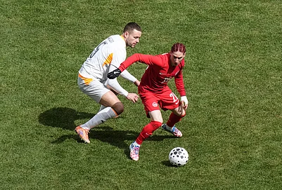 | Photo: Chris Young/The Canadian Press via AP : Canadas Marcelo Flores turns away from Icelands Sverrir Ingi Ingason during the second half of an international friendly soccer match in Toronto.
