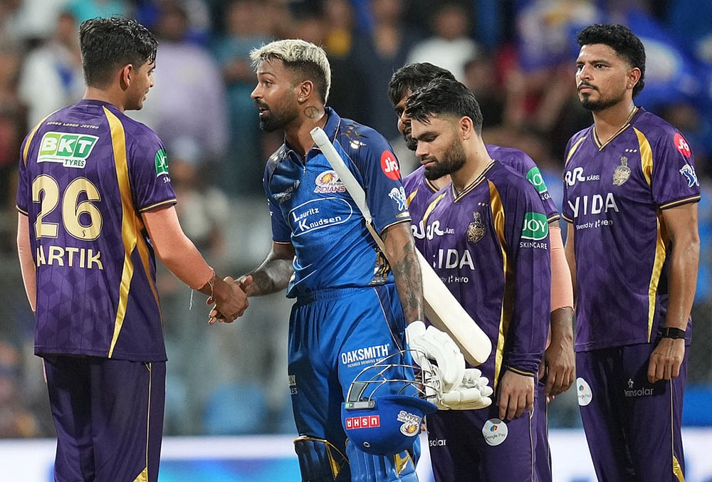 | Photo: AP/Rafiq Maqbool : Mumbai Indians captain Hardik Pandya, second left, shake hands with Kolkata Knight Riders Kartik Tyagi after won the match during the Indian Premier League cricket match between Mumbai Indians and Kolkata Knight Riders in Mumbai.