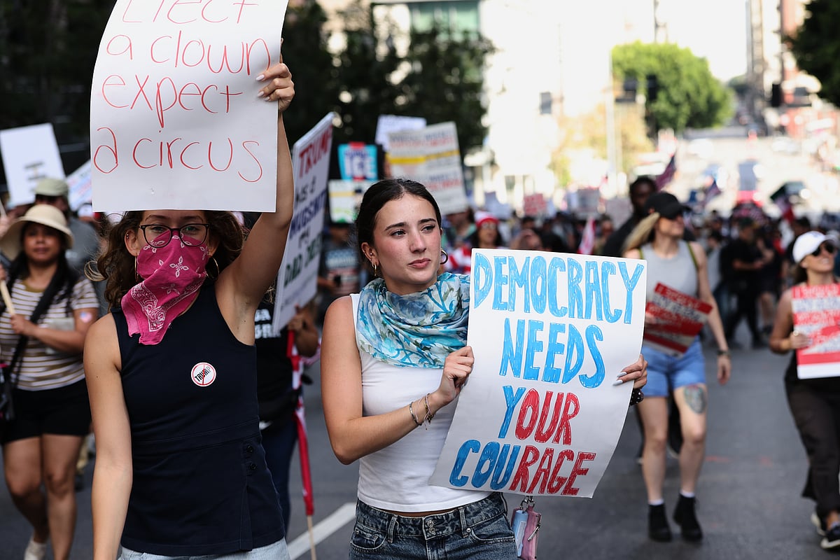 Source: AP
 : Demonstrators march through downtown Los Angeles during a No Kings protest Saturday, March 28, 2026. (AP Photo/Jill Connelly)