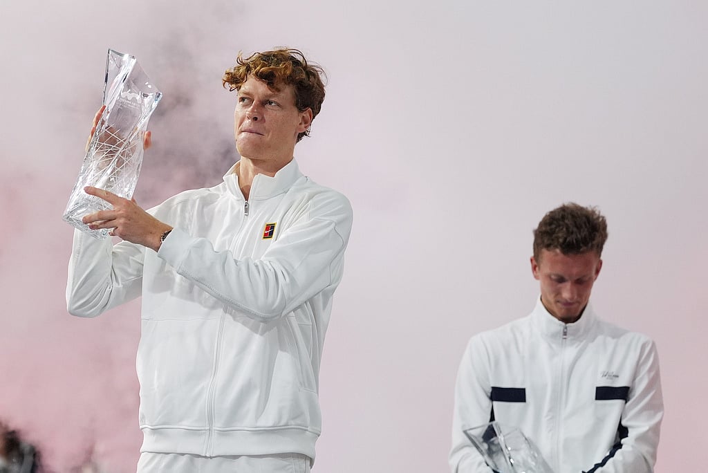 | Photo: AP/Rebecca Blackwell : Jannik Sinner of Italy hoists the Butch Buchholz trophy after defeating Jiri Lehecka of the Czech Republic, right, in the mens singles final at the Miami Open tennis tournament in Miami Gardens, Florida. 