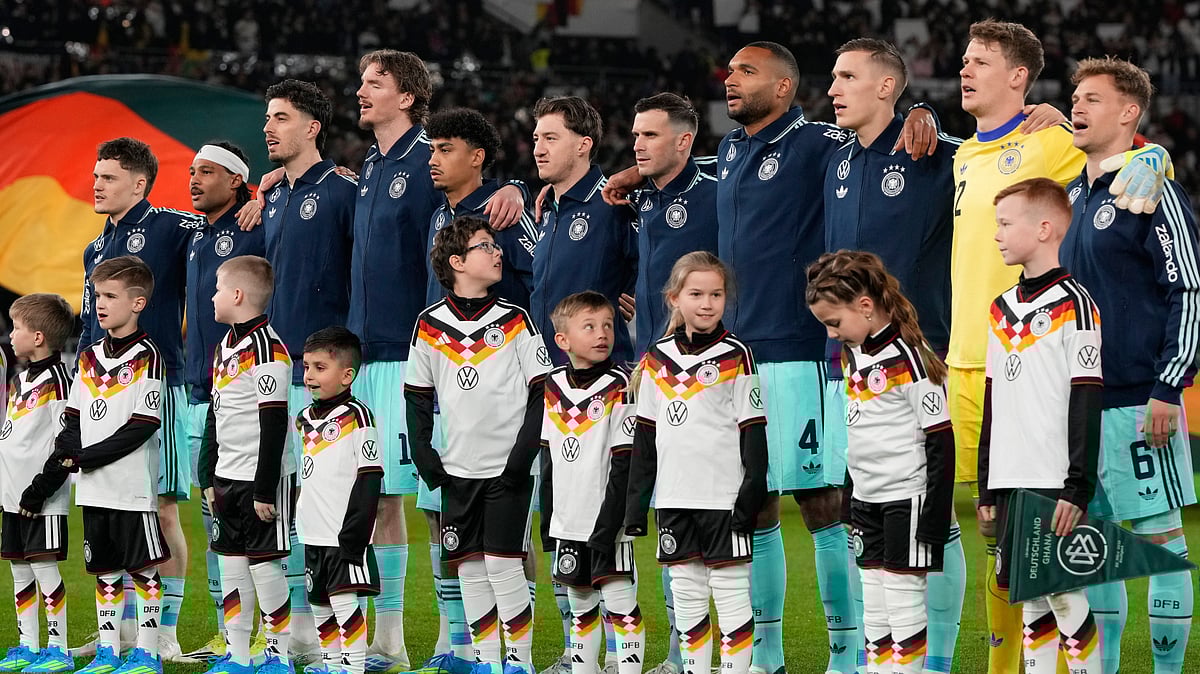 AP/Matthias Schrader : Team Germany sings the national anthem prior to an international friendly soccer match between Germany and Ghana in Stuttgart.