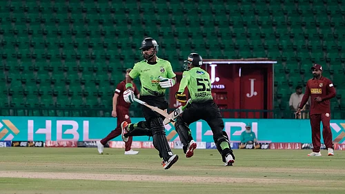 | Photo: APK.M. Chaudary : Lahore Qalandars Fakhar Zaman, second left, and Haseeb Ullah, second right, run between the wickets during the opening cricket match of the Pakistan Super League between Lahore Qalandars and Hyderabad Kingsmen, which taking place without spectators, in Lahore, Pakistan, Thursday, March 26, 2026.