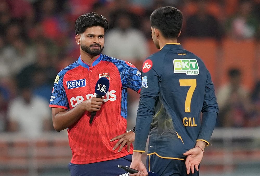 | Photo: PTI/Shiva Sharma : Punjab Kings captain Shreyas Iyer, left, and Gujarat Titans Shubman Gill during the toss before an Indian Premier League (IPL) 2026 T20 cricket match between Punjab Kings and Gujarat Titans, in Mullanpur.