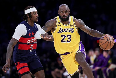 | Photo: AP/Ryan Sun : Los Angeles Lakers forward LeBron James, right, drives against Washington Wizards guard Jamir Watkins during the second half of an NBA basketball game in Los Angeles.