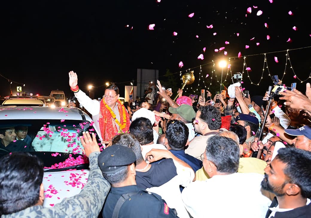 Uttarakhand CM Dhami receiving a warm welcome from BJP workers and locals