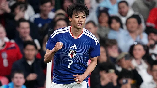 AP Photo/Kirsty Wigglesworth : Japans Kaoru Mitoma celebrates after scoring his sides first goal during the International friendly soccer match between England and Japan in London, Tuesday, March 31, 2026 .