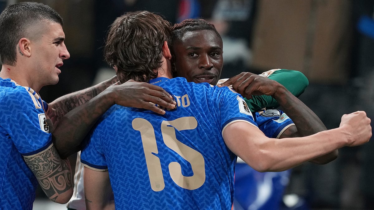 | Photo: AP/Antonio Calanni : Teammates celebrate with Italy's Moise Kean, right, who scored his side's second goal during the World Cup qualifying play-off soccer match between Italy and Northern Ireland, in Bergamo, Italy, Thursday, March 26, 2026.