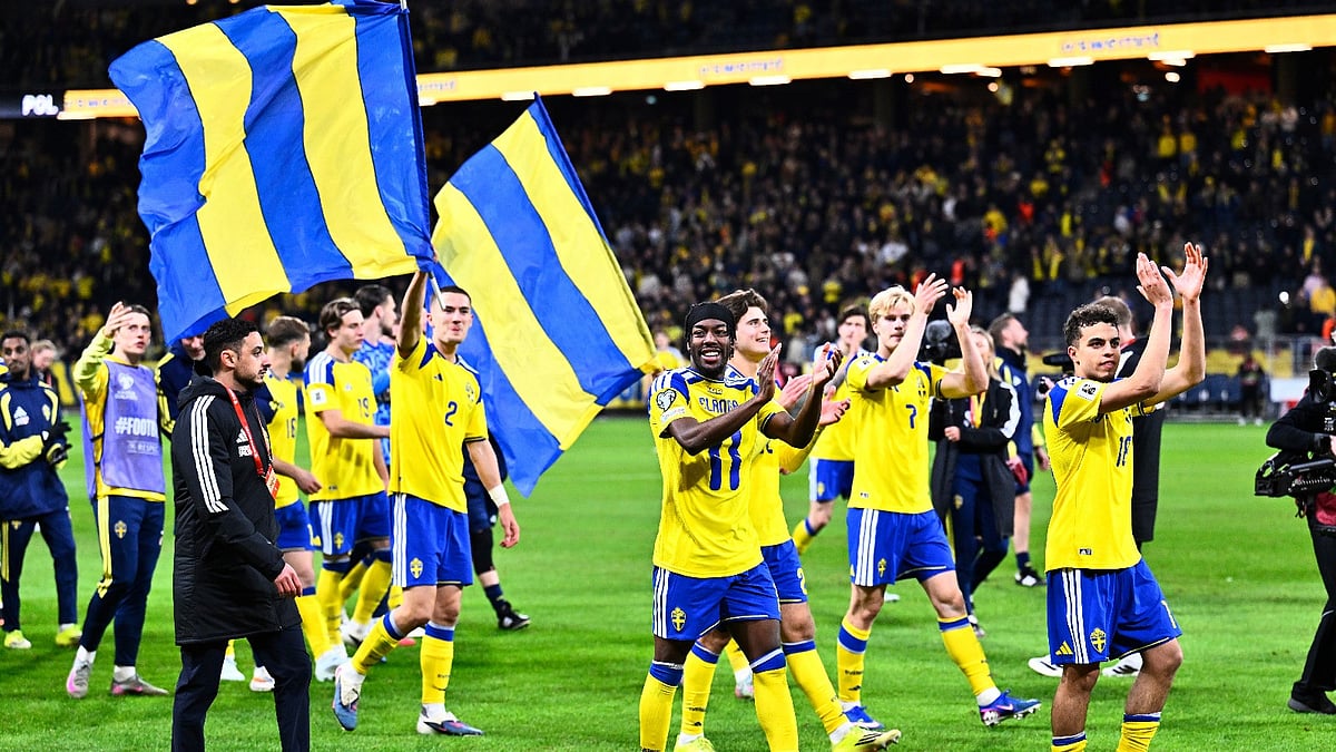 (Pontus Lundahl/TT via AP) : Sweden players and staff celebrate qualifying for the World Cup after a World Cup qualifying playoff final soccer match between Sweden and Poland in Stockholm, Tuesday, March 31, 2026.