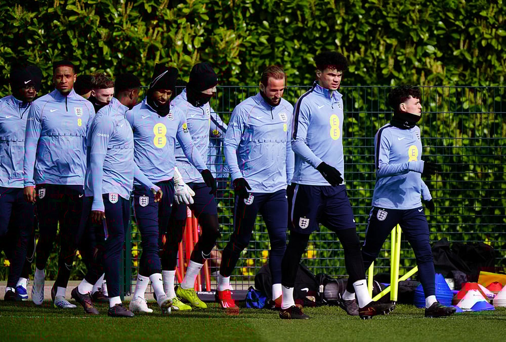 | Photo: Bradley Collyer/PA via AP : Englands Phil Foden, Nico OReilly, and Harry Kane with team mates during a training session in London.