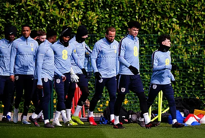 | Photo: Bradley Collyer/PA via AP : Englands Phil Foden, Nico OReilly, and Harry Kane with team mates during a training session in London.