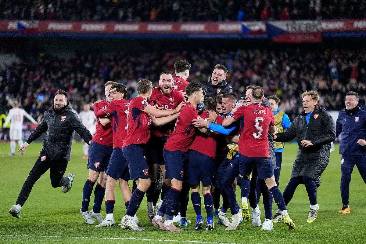 AP Photo/Petr David Josek : Czechia players celebrate after winning a penalty shootout at the end of the World Cup qualifying playoff final soccer match between Czechia and Denmark in Prague, Tuesday, March 31, 2026.