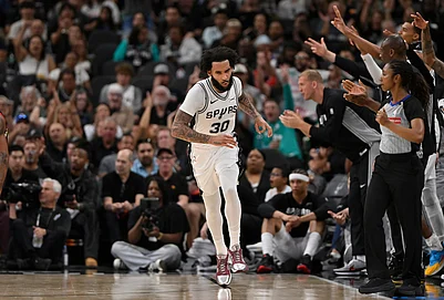 | Photo: AP/Darren Abate : San Antonio Spurs forward Julian Champagnie (30) celebrates after a 3-point basket during the second half of an NBA basketball game against the Chicago Bulls in San Antonio.