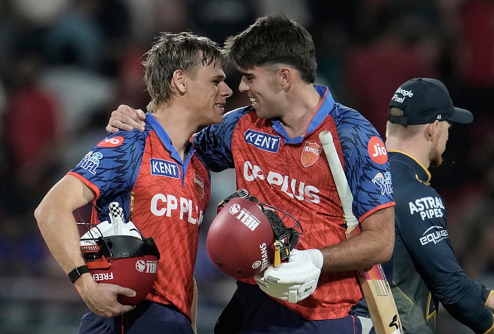 | Photo: AP/Ashwini Bhatia : Punjab Kings Cooper Connolly, left, and Xavier Bartlett celebrates the win against Gujarat Titans during the Indian Premier League cricket match in New Chandigarh.