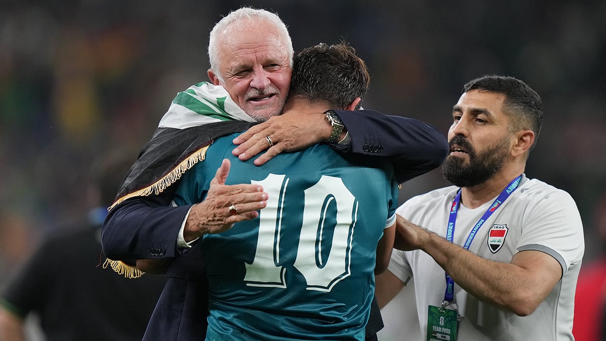(AP Photo/Fernando Llano) : Iraq's coach Graham Arnold, left, and Mohanad Ali (10) celebrate at the end of the World Cup playoff final soccer match between Iraq and Bolivia in Monterrey, Mexico, Tuesday, March 31, 2026