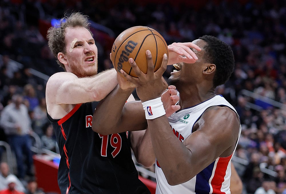 | Photo: AP/Duane Burleson : Detroit Pistons center Jalen Duren (0) is fouled by Toronto Raptors center Jakob Poeltl (19) while going to the basket during the second half of an NBA basketball game in Detroit. 